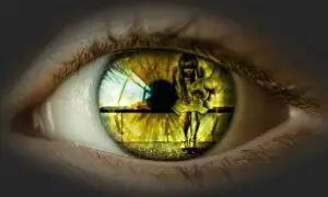 Close-up of a human eye reflecting a young girl sitting in fear on a bench, with the shadow of a clenched fist in front of her, symbolizing the trauma of domestic violence.